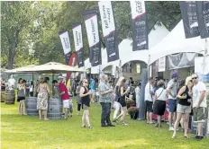  ??  ?? The first weekend of the Niagara Grape and Wine Festival kicked into high gear in the downtown park on Friday. People began filling up the park for another festive day on Saturday.