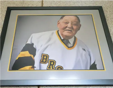  ?? MICHELLE BERG ?? A photos of Elgar Petersen that hangs in the Elgar Petersen Arena in Humboldt. While age and health have forced him to retire from his work with the team, he has been involved with the Broncos from the team’s start and was a constant presence at the...