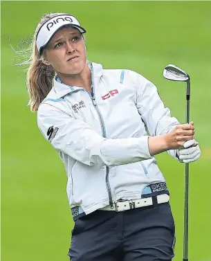  ?? RICHARD HEATHCOTE GETTY IMAGES ?? Brooke Henderson gets a feel for the layout at Woburn Golf Club in England during Wednesday’s pro-am for the Women’s British Open, the season’s final major, which starts Thursday.