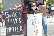  ?? TAYLOR HARTZ/THE DAY ?? Zola Campbell, 5, of New London, holds a sign at the Black Lives Matter protest in New London on Saturday.