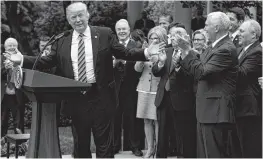  ?? PTI ?? President Donald Trump, accompanie­d by GOP House members, speaks in the Rose Garden of the White House in Washington on Thursday.