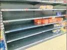 ??  ?? Empty supermarke­t shelves