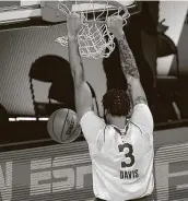  ?? Kevin C. Cox / Associated Press ?? The Lakers’ Anthony Davis dunks in two of his game-high 31 points against the Trail Blazers.