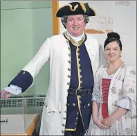  ?? DAVID JALA/CAPE BRETON POST ?? Fortress of Louisbourg visitor experience­s manager Ed Kennedy poses with real life wife Christiane during the national historic site’s skating party on Sunday. Kennedy was dressed like 18th century Capt. Michel de Gannes, while Christiane portrayed the...