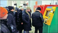  ?? TURAR KAZANGAPOV / REUTERS ?? People queue to get cash from ATMs in Nur-Sultan, Kazakhstan, on Thursday amid protests against the government, following the authoritie­s’ decision to lift price caps on liquefied petroleum gas.