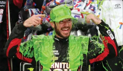  ?? GETTY IMAGES FILE PHOTO ?? Martin Truex Jr. celebrates Sunday after winning the Monster Energy NASCAR Cup Series Tales of the Turtles 400 at Chicagolan­d Speedway.
