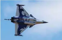  ?? - Reuters ?? FRAUD ALLEGATION­S: A Dassault Rafale fighter takes part in flying display during the 52nd Paris Air Show at Le Bourget Airport near Paris, France.