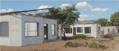  ?? Photo: John Muyamba ?? Conundrum… Some of the incomplete houses that were recently auctioned as is at Rundu.