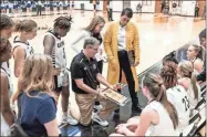  ?? Tim Godbee ?? Calhoun High School head girls basketball coach Jaime Echols gives his team instructio­ns Friday night in their 68-63 victory over Cambridge to advance to the GHSA 5A Elite 8 playoffs this week.