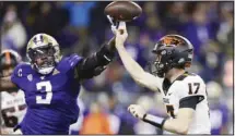  ?? (AP) ?? Washington defensive lineman Jeremiah Martin (3) blocks a pass from Oregon State quarterbac­k Ben Gulbranson (17) during the first half of an NCAA college football game in Seattle.