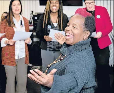  ?? MELANIE STENGEL/SPECIAL TO THE COURANT ?? Gwenath Douglas, front, leads a group of union members in a final practice of the song they will sing Saturday during a rally at the end of the Women’s March in Hartford. The song, “Treat Us Like Family,” was written by Sheena Graham, of West Haven.