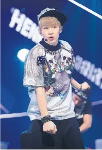  ?? HAN MYUNG-GU TORONTO STAR FILE PHOTO ?? Toronto singer/actor Lau, seen performing in 2013, was in the hugely popular K-pop boy band Super Junior M until last year.