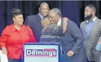  ?? ORLANDO SENTINEL STAFF FILE PHOTO ?? Orange County Sheriff Jerry Demings hugs family members Aug. 28 after being elected Mayor of Orange County in a land slide victory. Demings, 59, who was Orange County sheriff for eight years, will be the county’s first African American mayor.