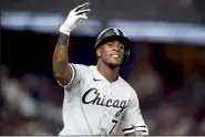  ?? AP photo ?? Tim Anderson of the White Sox gestures to the crowd while running the bases after hitting a three-run homer in the eighth inning of Game 2 of a doublehead­er against the Yankees on Sunday.