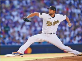  ?? AP PHOTO/ABBIE PARR ?? National League starting pitcher Clayton Kershaw of the Los Angeles Dodgers throws to an American League batter during the first inning of the MLB All-Star game Tuesday.