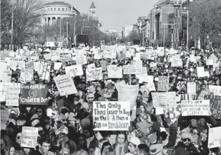  ?? Nicholas KAMM/AFP ?? People on Saturday gather in Washington, D.C., for the March for Our Lives rally against gun violence. Galvanized by the Feb. 14 massacre at a Florida high school, hundreds of thousands took to the streets in cities nationwide.