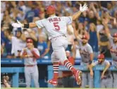  ?? HARRY HOW/GETTY ?? Cardinals’ Albert Pujols celebrates hitting his 700th career home run Friday night at Dodger Stadium in Los Angeles.