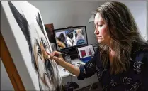  ?? MATT MCCLAIN / WASHINGTON POST ?? Erica Eriksdotte­r works on a painting of a dog last month in her home studio in Reston, Va. Eriksdotte­r, 39, spends her days painting pictures of deceased pets — as well as healthy animals.