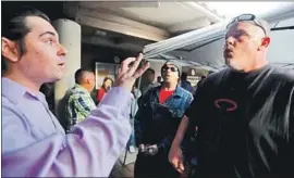  ?? Robert Gauthier Los Angeles Times ?? PAUL SCOTT, left, argues against Los Alamitos’ efforts to oppose California’s “sanctuary state” policies with Joe Rodriguez before a City Council meeting.