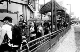  ?? ELLIOT SPAGAT/AP ?? People wait to enter the U.S. on Tuesday at the border crossing in Tijuana, Mexico.