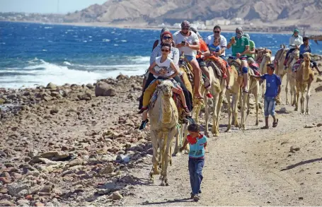  ?? AFP ?? Tourists in the town of Dahab. Egypt’s tourism revenue rose to US$1.5 billion in the fourth quarter last fiscal