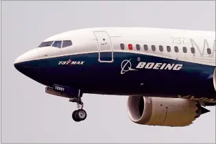  ?? AP FILE PHOTO ?? A Boeing 737 Max jet, piloted by FAA chief Steve Dickson, prepares to land at Boeing Field following a test flight in Seattle in this Sept. 30, 2020 file photo.