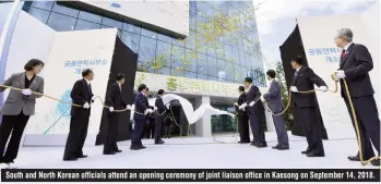  ??  ?? South and North Korean officials attend an opening ceremony of joint liaison office in Kaesong on September 14, 2018.