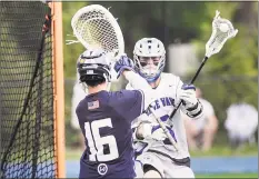  ?? Bob Luckey Jr. / Hearst Connecticu­t Media ?? Darien’s Hudson Pokorny prepares to shoot against Wilton goalie Andrew Calabrese during the Blue Wave’s 11-10 victory on Saturday in Darien.