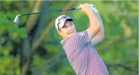  ?? Photo / Getty Images ?? Ryan Fox plays a tee shot on the second hole.