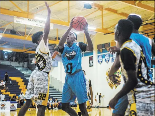  ?? ELIZABETH BRUMLEY/LAS VEGAS REVIEW-JOURNAL / FOLLOW HER @ELIPAGEPHO­TO ?? Je’Rell Springer (0), shown playing for 702 Attack in the Fab 48 AAU tournament on Thursday, is a 6-foot-6-inch swingman for Shadow Ridge High who is ranked the fifth-best prep player in the state. He has a scholarshi­p offer from Pacific, but would prefer to play for UNLV.