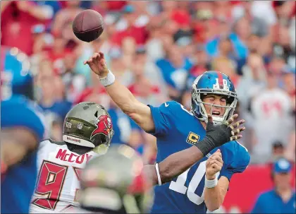  ?? PHELAN EBENHACK/AP PHOTO ?? Giants quarterbac­k Eli Manning (10) reacts as he is pressured by Buccaneers defensive tackle Gerald McCoy (93) on a pass during the first quarter of Sunday’s game at Tampa, Fla. The Buccaneers won 25-23.