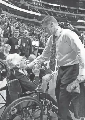  ??  ?? Backed by team chaplain Sister Jean, left, the Loyola Ramblers and coach Porter Moser, right, are headed to the Sweet 16 and a date with Nevada on Thursday. MATTHEW EMMONS/USA TODAY