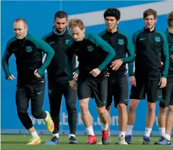  ?? — AP ?? FC Barcelona players at a training session in Sant Joan Despi, Spain, on Monday ahead of their Champions League match against Borussia Monchengla­dbach.