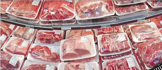  ?? J. S C O T T A P P L E WH I T E / T H E A S S O C I AT E D P R E S S F I L E S ?? U. S. business groups are asking l awmakers to change the country- of- origin meat- l abelling rules before Canada retaliates.