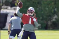  ?? Steven Senne / Associated Press ?? New England Patriots quarterbac­k Cam Newton throws the ball during practice on Wednesday in Foxborough, Mass.