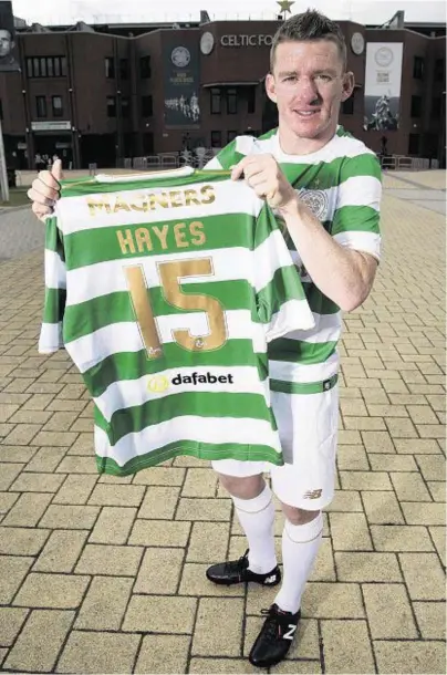  ??  ?? HAPPY HOOP: Jonny Hayes shows off his jersey after signing for Celtic