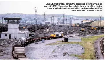  ??  ?? Class 31 31158 snakes across the pointwork at Tinsley yard on August 9 1985. The distinctiv­e architectu­ral style of the control tower - typical of many marshallin­g yards - can be modified from Peco kits. GAVIN MORRISON