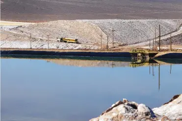  ?? STEVE MARCUS/ASSOCIATED PRESS ?? A truck carries away waste salt at the Silver Peak lithium mine near Tonopah, Nevada. The Trump administra­tion granted final approval for a proposed northern Nevada lithium mine, one of several eleventh-hour moves made by the Department of Interior to greenlight mining and energy projects.