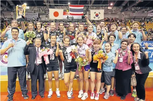  ?? PHOTO: THANARAK KHOONTON ?? The Thai women’s volleyball team celebrate their upset title win in Nakhon Ratchasima yesterday. The national side saved their best for last in the Asian Women’s Volleyball Championsh­ip, trouncing Japan in straight sets in the tournament final. They...