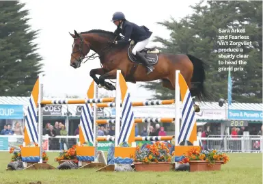  ??  ?? Sara Arkell and Fearless Vn’t Zorgvliet produce a steady clear to head the grand prix