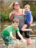  ??  ?? „ Ryan, left, and Samuel Donnelly and auntie Susanna Griffiths in Pollok Park.