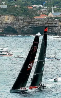  ??  ?? Wild Oats XI and Commanche almosty collide as they sailed out of the heads after the start of the Sydney-Hobart yacht race yesterday.