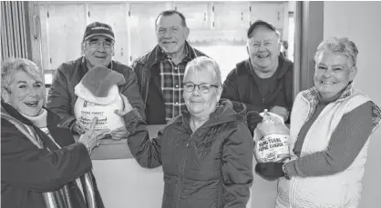  ?? ERIC MCCARTHY/JOURNAL PIONEER ?? A core group of volunteers is shown at St. Anthony’s Hall in Woodstock recently as they met to finalize planning for their 10th annual Christmas Day meal. Front row, from left, are Peggy Meters, Helen Murphy, Jean Hagen. In the back row are Preston Murphy, Ted Peters and John Hagen Organizers ended up feeding about 300 people between noon and 3 p.m. on Christmas day.