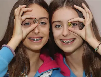  ?? PHOTO: ROBBIE REYNOLDS ?? Medals: Twin sisters Robin and Alex Andres, from Lucan, Co Dublin, at the Irish Girl Guides National Guide Awards held in Croke Park.