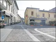  ?? (File Photo/AP/Luca Bruno) ?? A deserted road is seen in the town of Codogno, near Lodi, Northern Italy, in this Feb. 22 photo.