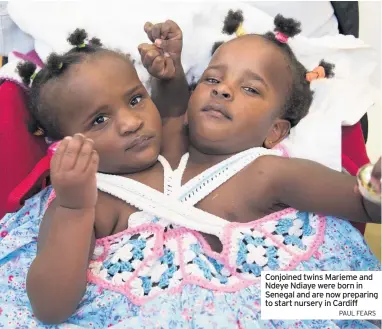  ?? PAUL FEARS ?? Conjoined twins Marieme and Ndeye Ndiaye were born in Senegal and are now preparing to start nursery in Cardiff