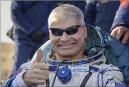  ?? BILL INGALL — NASA VIA AP ?? NASA astronaut Mark Vande Hei outside the Soyuz MS-19spacecra­ft after he landed with Russian cosmonauts Anton Shkaplerov and Pyotr Dubrov on Wednesday.