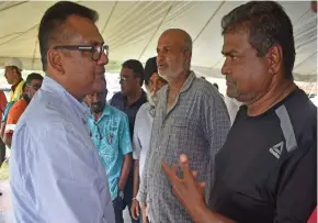  ?? Photo: Waisea Nasokia. ?? Permanent secretary for Sugar Yogesh Karan (left) talks with the farmers during the consultati­on in Rarawai, Ba on August 10, 2019.