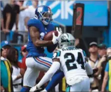  ?? JASON E. MICZEKJASO­N E. MICZEK — THE ASSOCIATED PRESS ?? Giants wide receiver Odell Beckham, catching a pass last week over Panthers defensive back James Bradberry, is off to a fast start to the season. That makes him a rarity as the Giants and Eagles, two teams stumbling out of the gates, collide Thursday night.