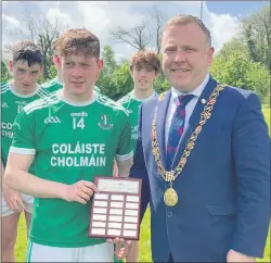  ?? ?? Lord Mayor od Cork, Colm Kelleher presenting the cup to St. Colman’s College captain, Jamie Magner.